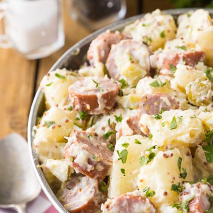 A bowl of potato salad made with potatoes, Halal Chicken Sausages and seasonings.